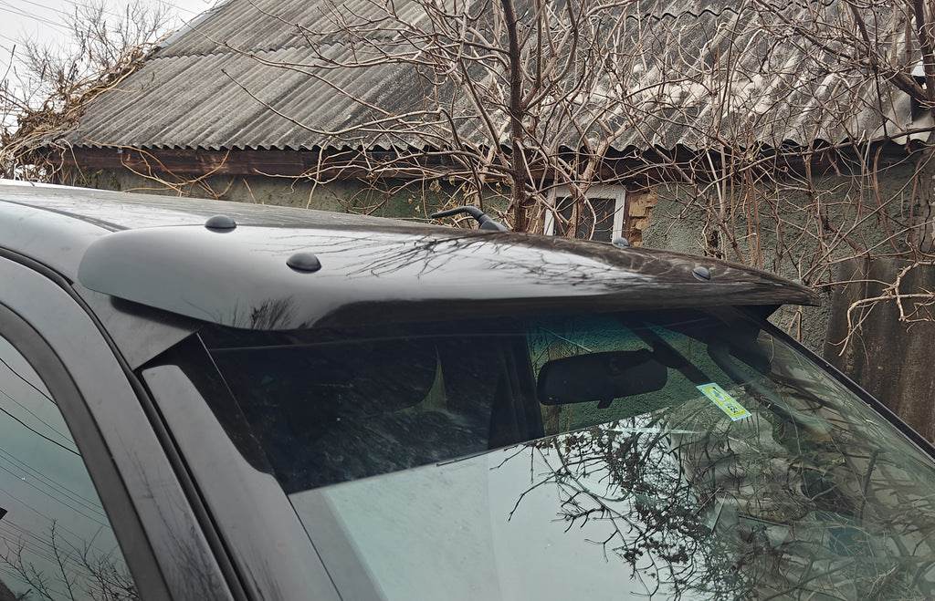 The visor on the windshield (on the frame) for Nissan Navara 2006-2015 - Reelken Auto