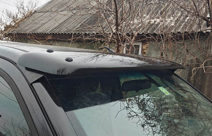 The visor on the windshield (on the frame) for Nissan Navara 2006-2015 - Reelken Auto