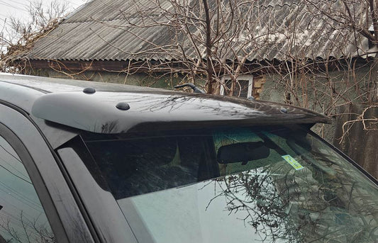 The visor on the windshield (on the frame) for Nissan Navara 2006-2015 - Reelken Auto