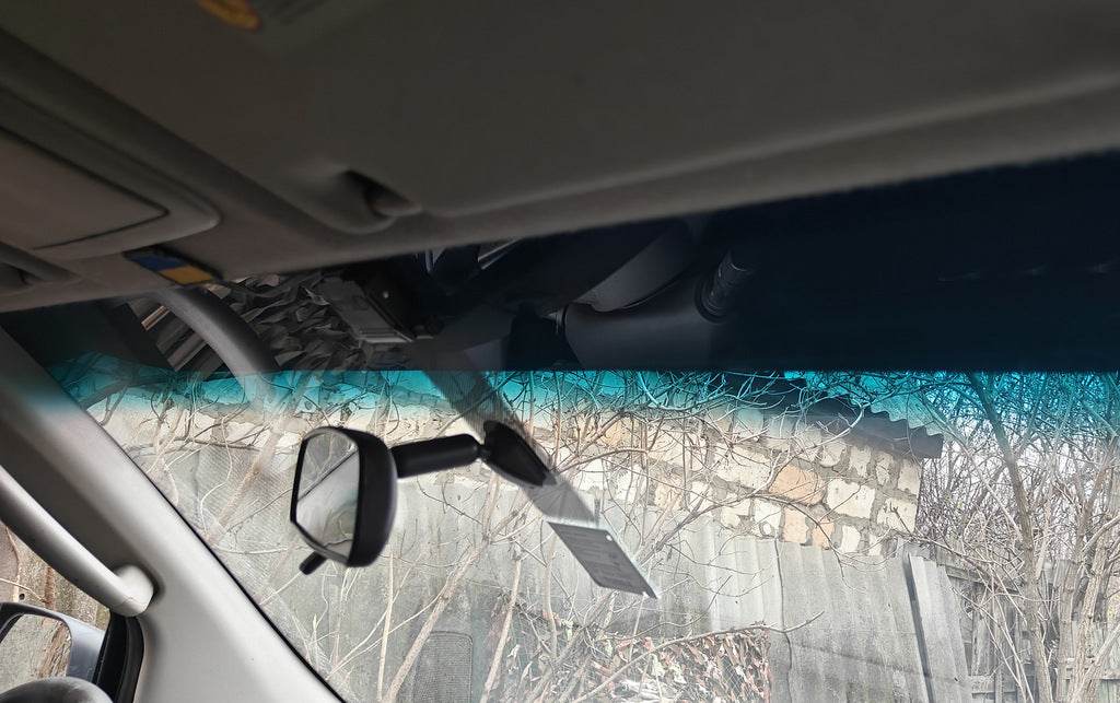 The visor on the windshield (on the frame) for Nissan Navara 2006-2015 - Reelken Auto