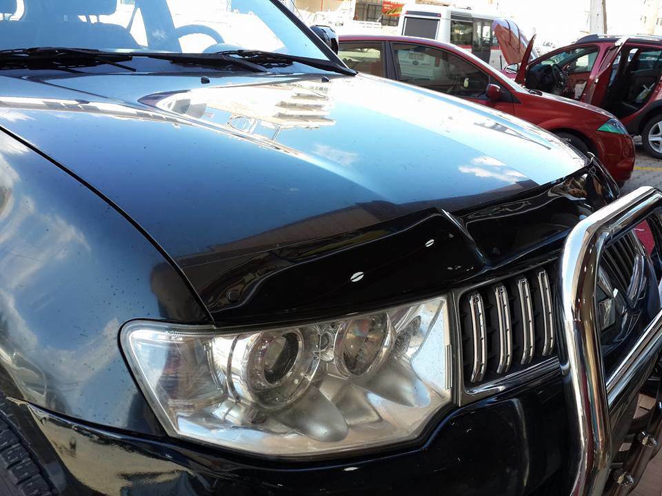 The hood deflector (EuroCap) for Mitsubishi L200 2006-2015 - Reelken Auto