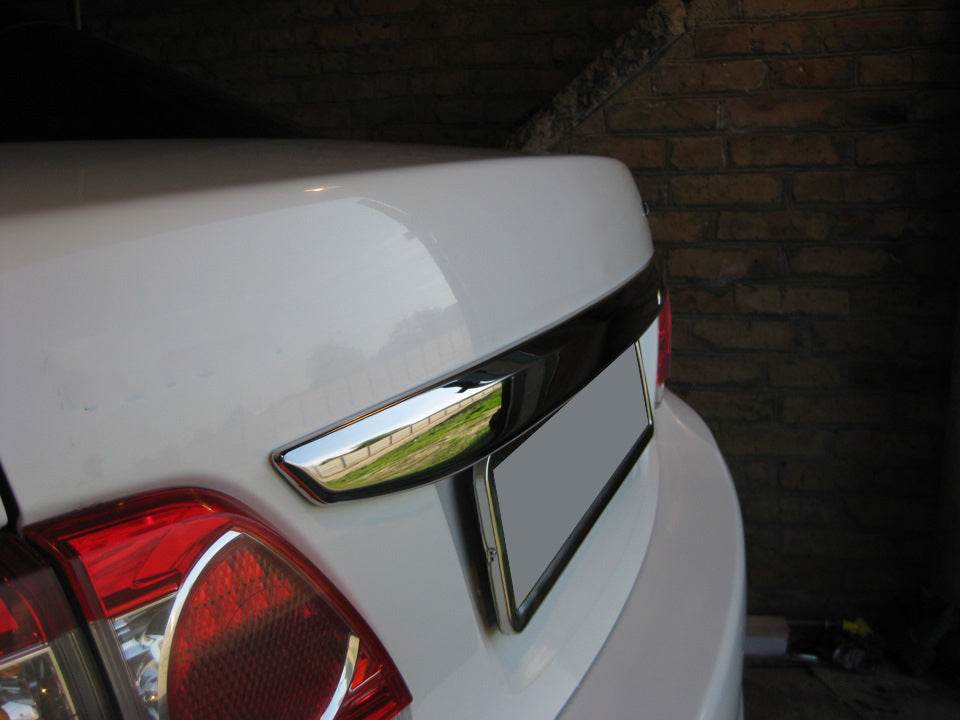 Cover over the number 2010-2013 (stainless) for Toyota Corolla 2007-2013 - Reelken Auto