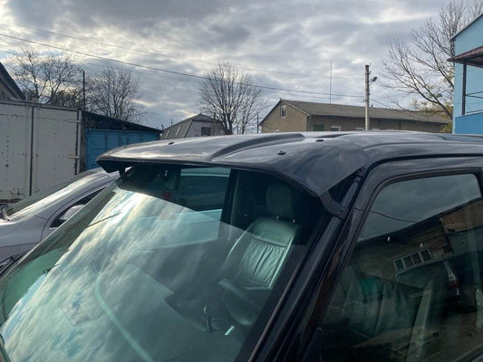 The visor on the windshield (gloss black, 5mm) for Volkswagen T4 Caravelle/Multivan - Reelken Auto