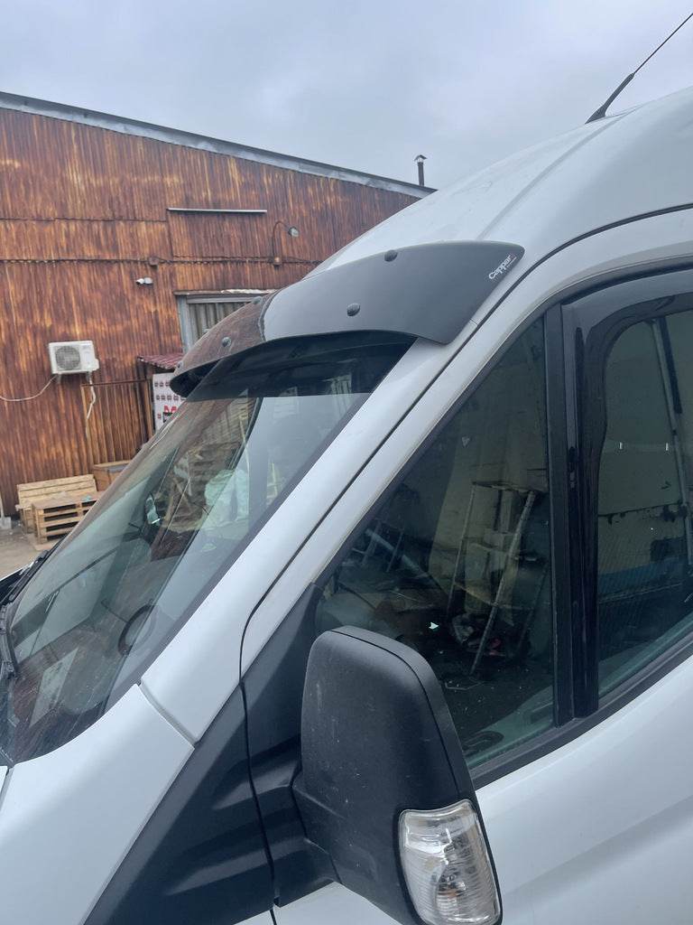 The visor on the windshield (gloss black, 5mm) for Ford Transit 2014↗ - Reelken Auto