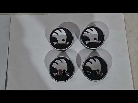 Wheel center caps 60/56mm 9068 (4 pcs) for Skoda - video 1