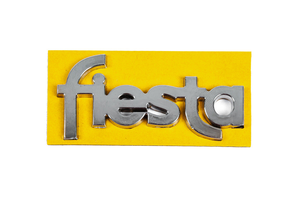 Emblem Fiesta 8401a (69mm x 35mm, for door) for Ford Fiesta 1995-2001 - image 1