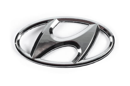 Emblem 86300-1J500 (125 mm x 65 mm) for Hyundai I-20 2008-2012 - image 1