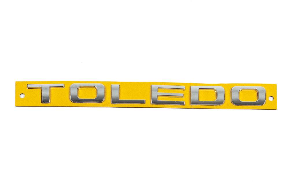 The inscription Toledo is 210 mm by 17 mm for Seat Toledo 2005-2012 - Reelken Auto